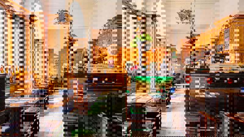 Interior of a Japanese-themed bar with lanterns and posters.