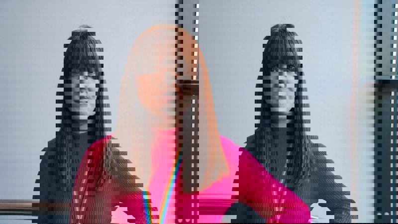 A head-and-shoulders portrait of Samantha McShane, who is wearing a colorful rainbow lanyard.