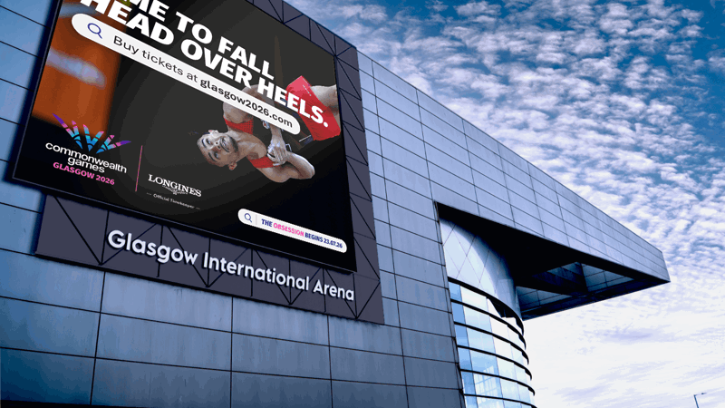  Gemini said A digital billboard on the Glasgow International Arena advertises the 2026 Commonwealth Games. It features a gymnast mid-flip with the slogan "Time to fall head over heels."