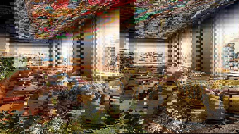 Modern rooftop lounge with vibrant ceiling artwork, cosy seating, plants, and city views at Sisi Rooftop in Glasgow