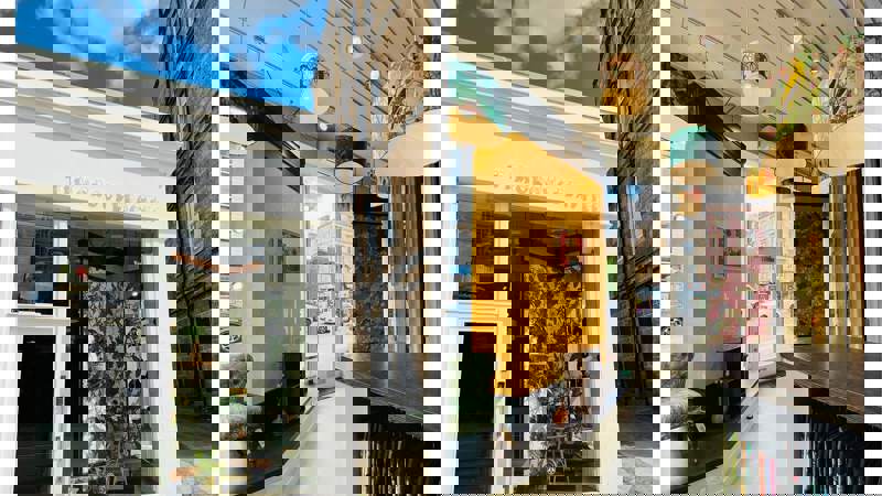 A two-part image showing the exterior of the Timorous Beasties shop and a view of its ornate interior.